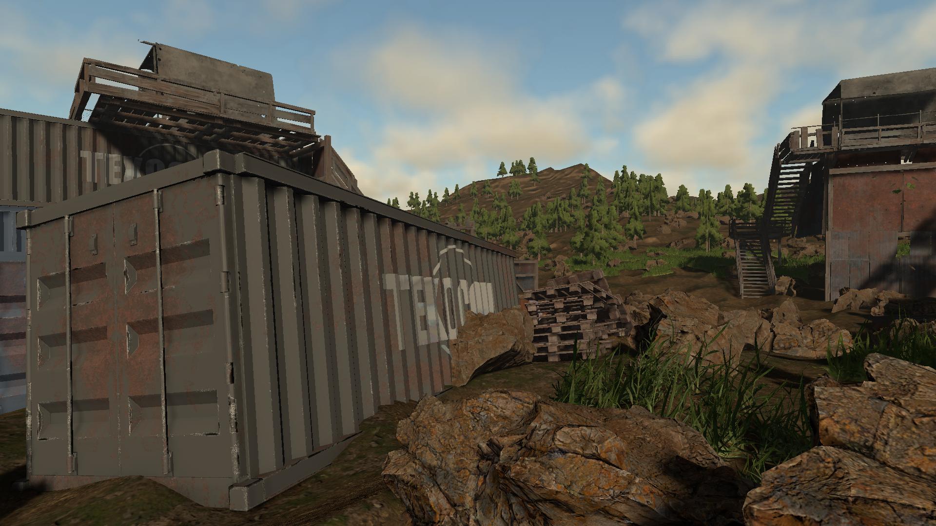 Standing beside a shipping container in a settlement