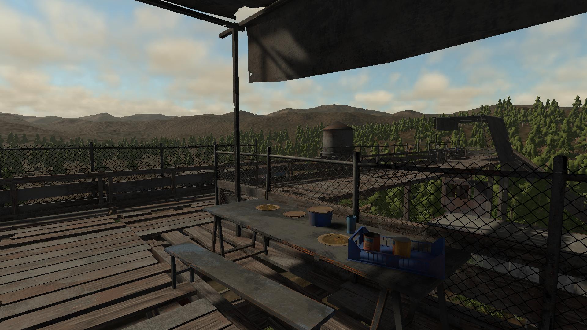 Food laid out on a broken picnic table in a settlement